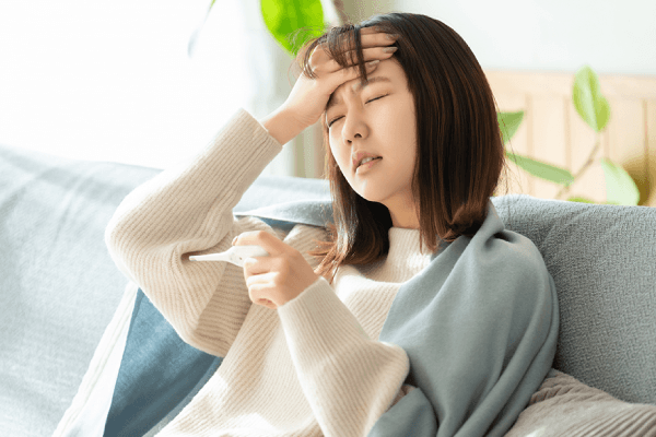 体調不良の女性