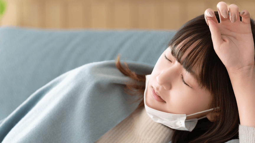 体調不良の女性